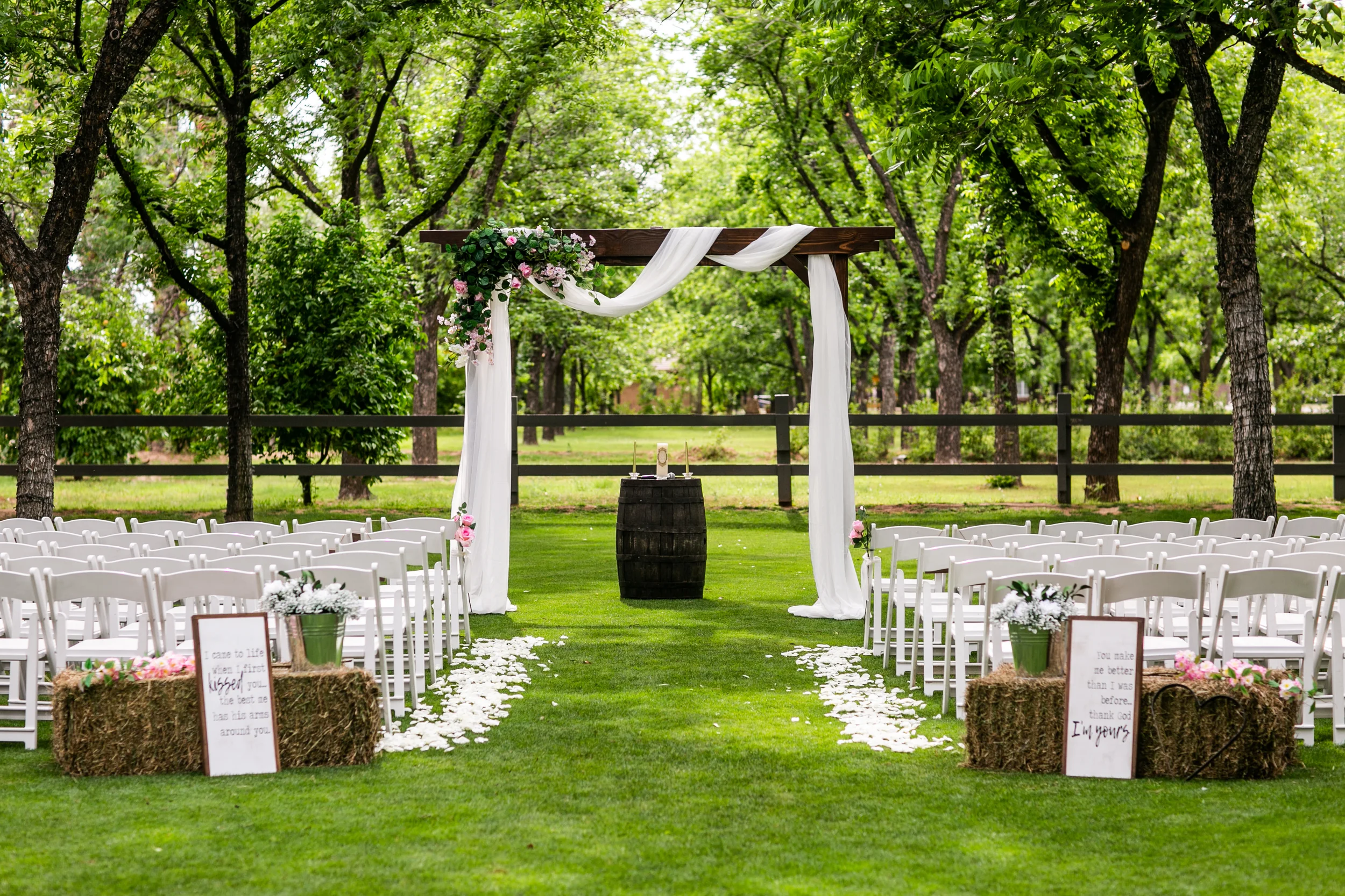 Wedding arch and chairs set up outside
